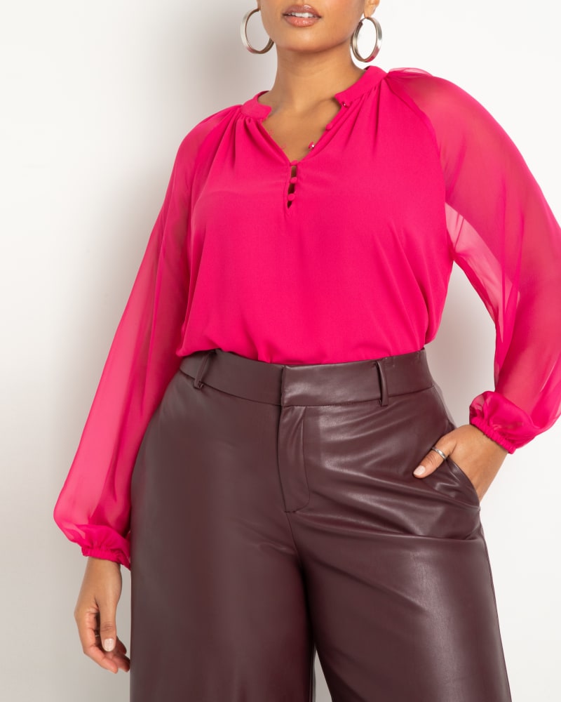 Front of a model wearing a size 14 Sheer Raglan Sleeve Blouse in Bright Pink by ELOQUII. | dia_product_style_image_id:271019